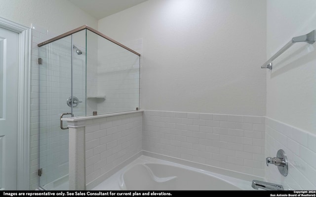 bathroom featuring plus walk in shower