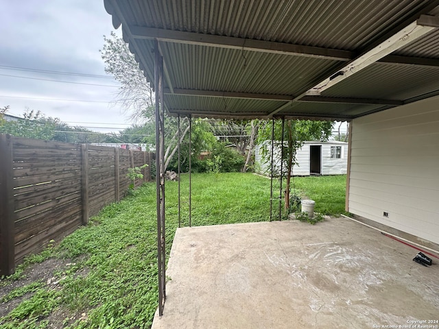 view of patio featuring a storage unit