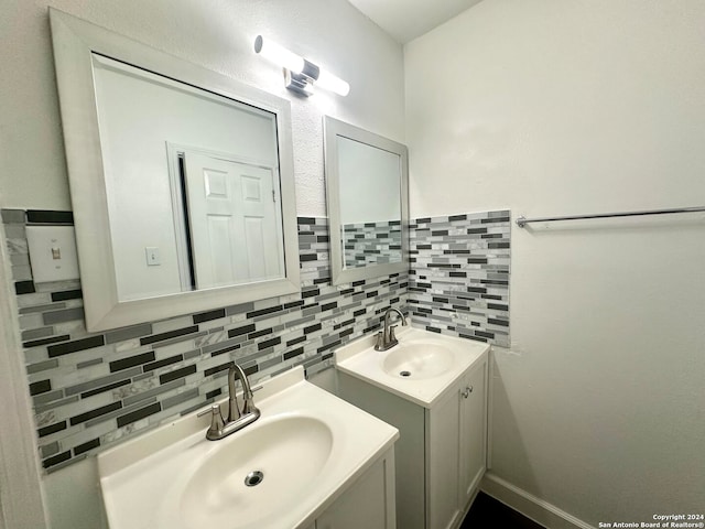 bathroom with vanity and backsplash