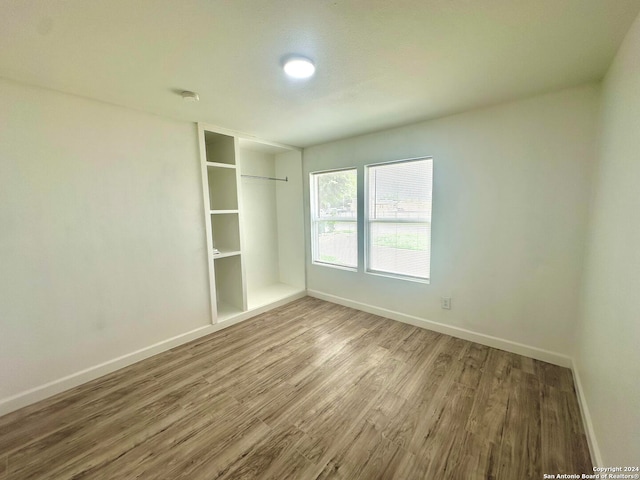 spare room featuring hardwood / wood-style floors