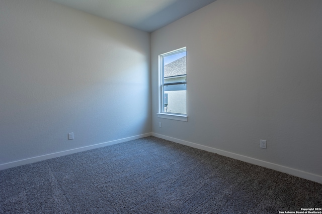 unfurnished room featuring carpet flooring