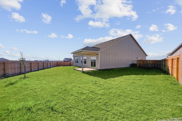 rear view of property with a patio area and a yard