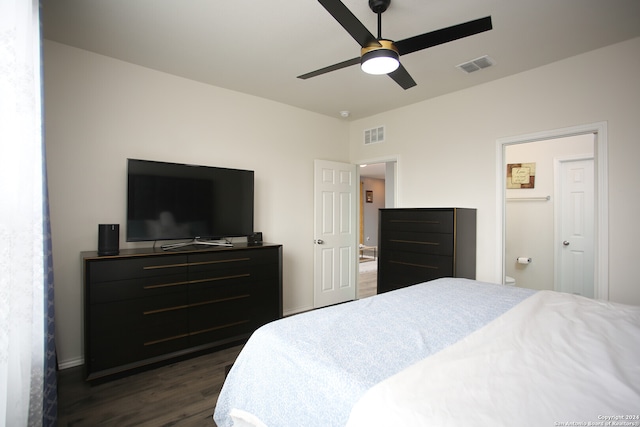 bedroom featuring dark wood-type flooring, ceiling fan, and connected bathroom