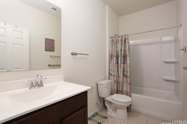 full bathroom featuring vanity, toilet, shower / bath combo with shower curtain, and tile patterned flooring