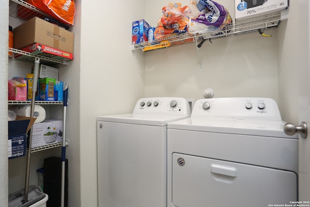 clothes washing area with washer and dryer