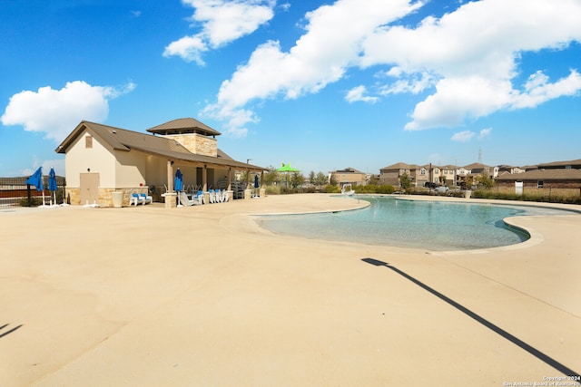 view of swimming pool featuring a patio