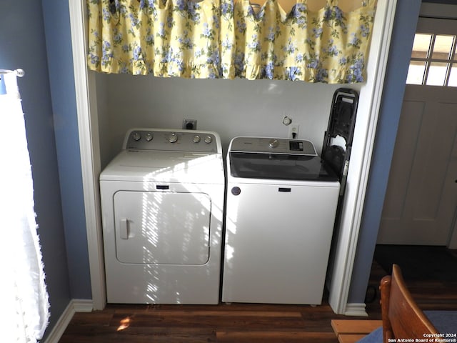 laundry area featuring independent washer and dryer and dark hardwood / wood-style floors