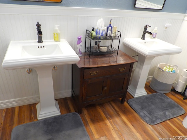 bathroom with hardwood / wood-style floors