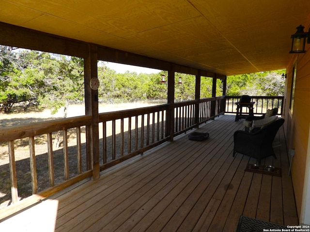 wooden terrace with a water view