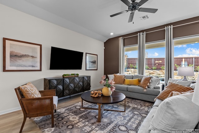 living room with hardwood / wood-style floors and ceiling fan