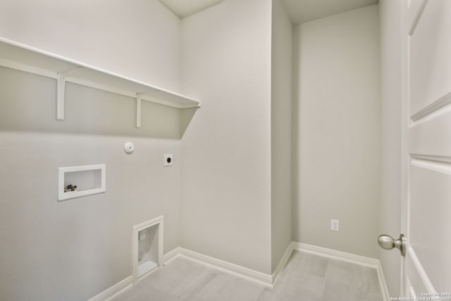 clothes washing area featuring hookup for a gas dryer, hookup for an electric dryer, and washer hookup