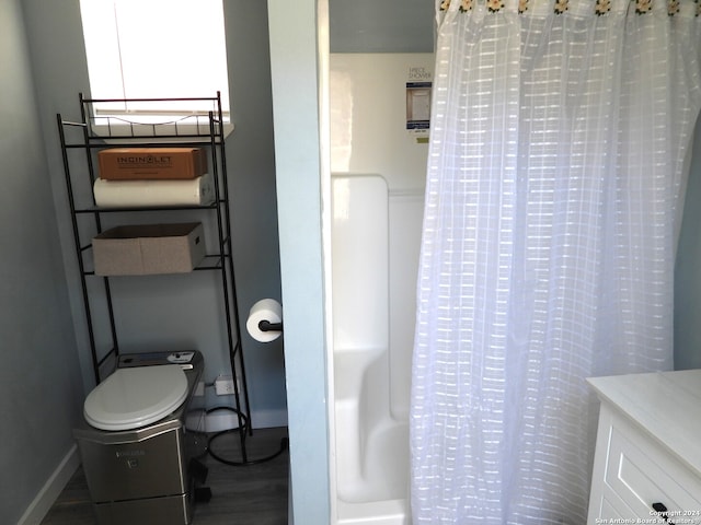 full bathroom with toilet, shower / tub combo with curtain, vanity, and wood-type flooring