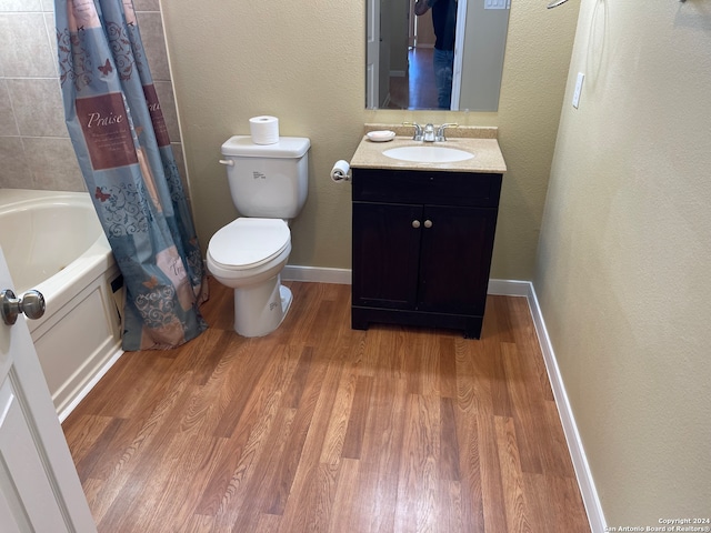 full bathroom featuring vanity, shower / bath combo, wood-type flooring, and toilet