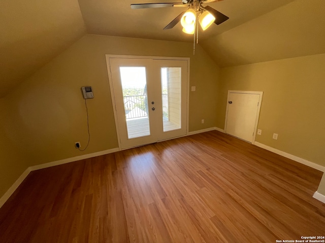 additional living space with vaulted ceiling, wood-type flooring, and ceiling fan