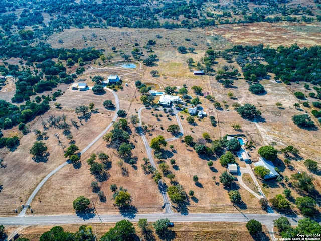 birds eye view of property featuring a rural view