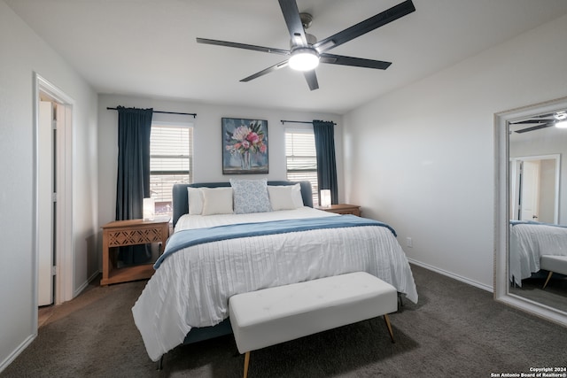 carpeted bedroom with multiple windows and ceiling fan