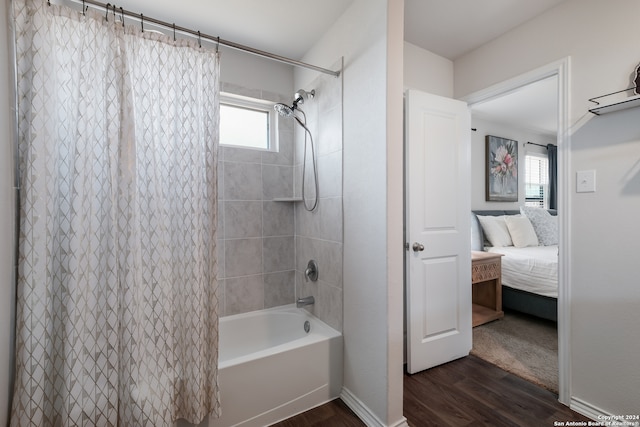 bathroom featuring shower / bath combo and hardwood / wood-style floors