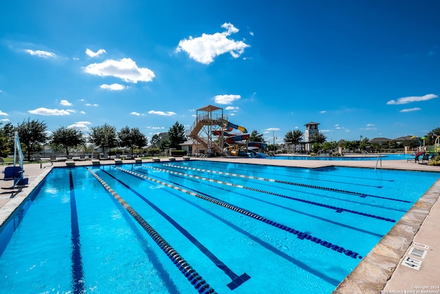 view of swimming pool featuring a water slide