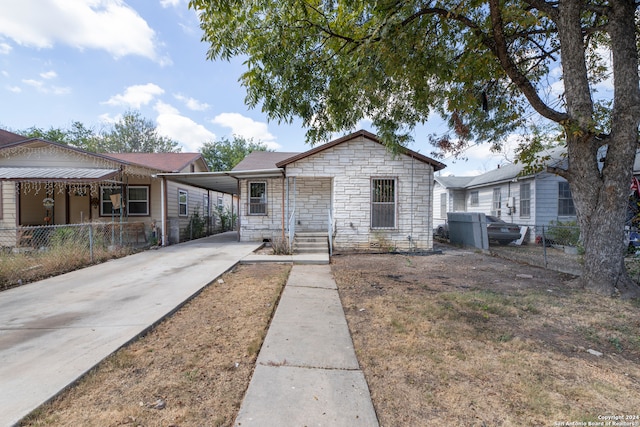 bungalow-style home featuring a carport