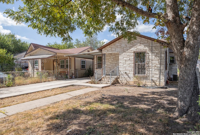 ranch-style home featuring cooling unit