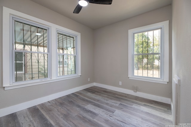 spare room featuring light hardwood / wood-style floors and ceiling fan