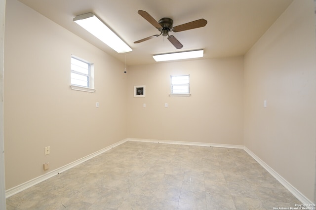 unfurnished room with plenty of natural light and ceiling fan