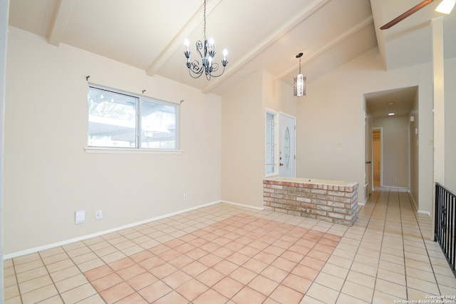 tiled spare room with a chandelier and lofted ceiling with beams