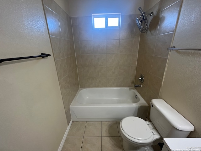 full bathroom with toilet, tiled shower / bath combo, vanity, and tile patterned flooring