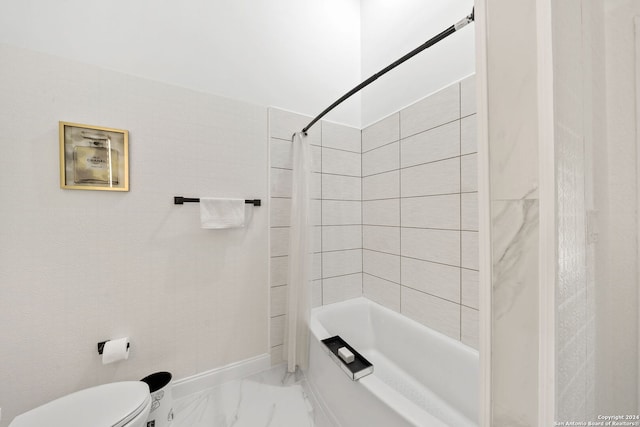 bathroom with toilet and shower / bath combo with shower curtain