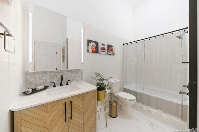 full bathroom with vanity, toilet, decorative backsplash, and shower / bath combo