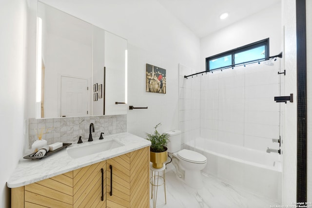 full bathroom featuring vanity, shower / bath combo with shower curtain, toilet, and tasteful backsplash