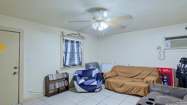 tiled living room featuring an AC wall unit and ceiling fan