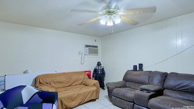 tiled living room featuring wooden walls, a wall unit AC, and ceiling fan