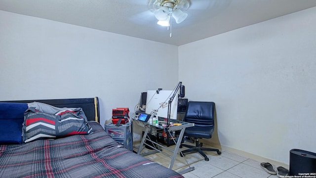 tiled bedroom with ceiling fan