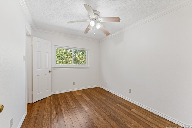 empty room featuring a textured ceiling, hardwood / wood-style flooring, ceiling fan, and ornamental molding