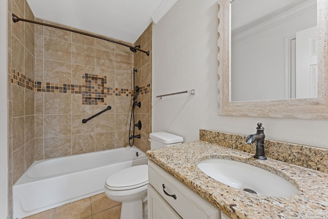 full bathroom featuring crown molding, toilet, vanity, and tiled shower / bath