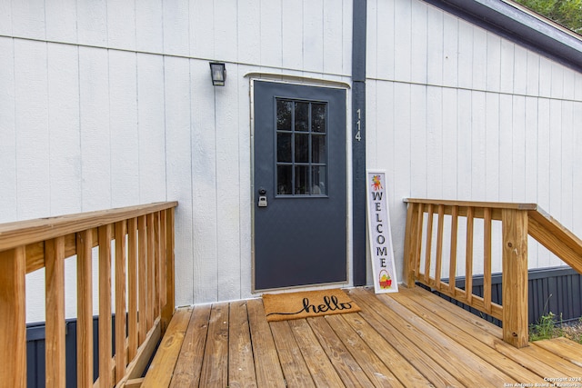 entrance to property with a deck