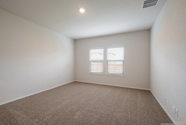 empty room featuring carpet floors