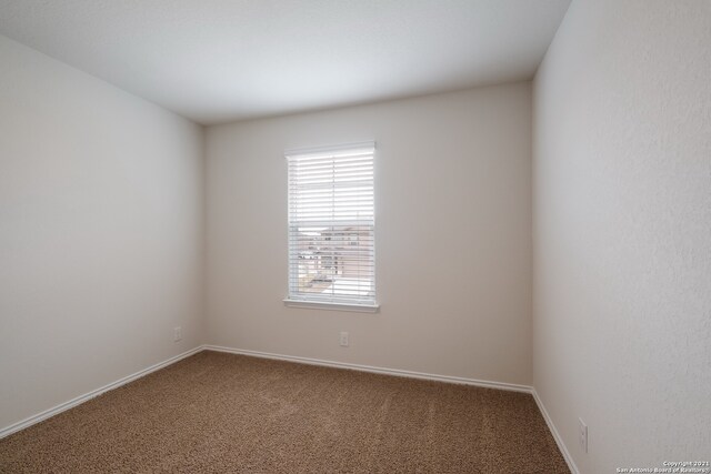 empty room featuring carpet