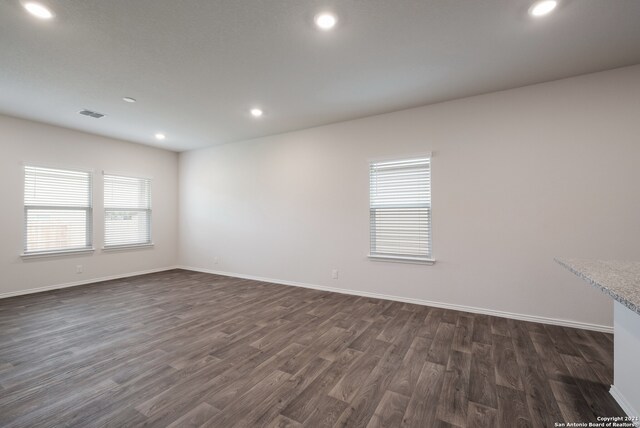 unfurnished room featuring dark hardwood / wood-style flooring