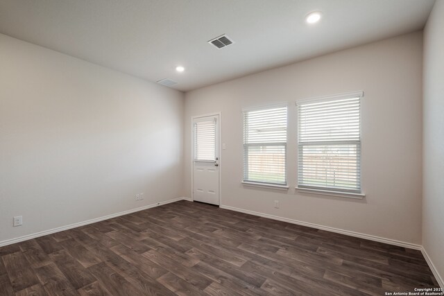 empty room featuring dark hardwood / wood-style floors