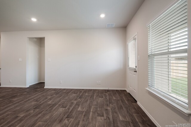 unfurnished room featuring dark hardwood / wood-style floors