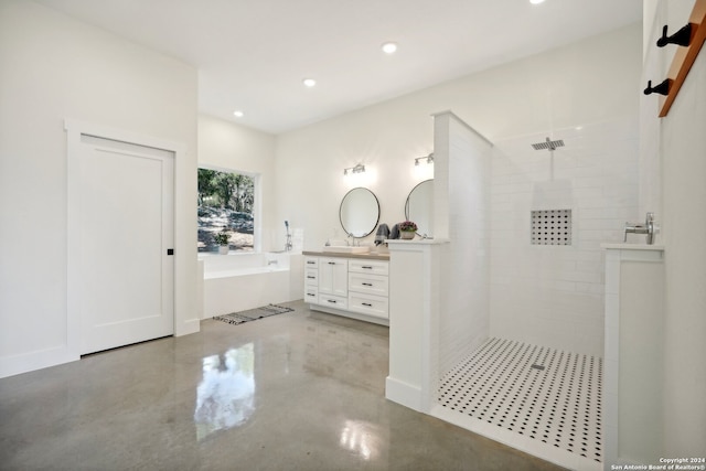 bathroom featuring a garden tub, finished concrete flooring, recessed lighting, vanity, and walk in shower