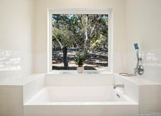 full bathroom featuring a garden tub