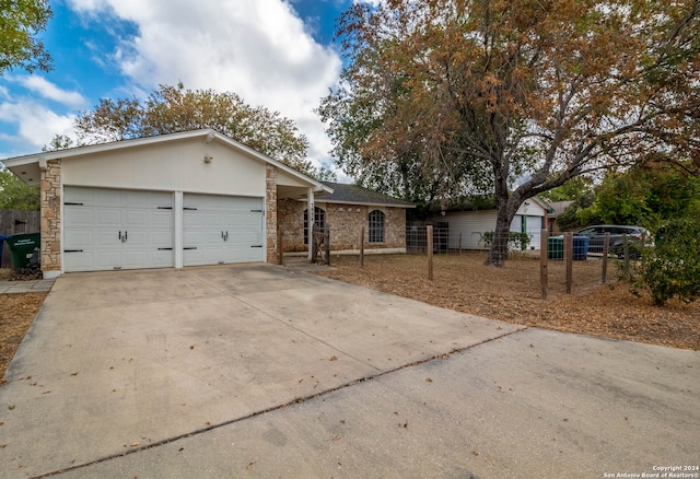 single story home featuring a garage