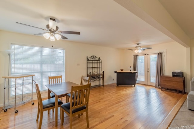 dining room with baseboards, ceiling fan, french doors, and light wood-type flooring