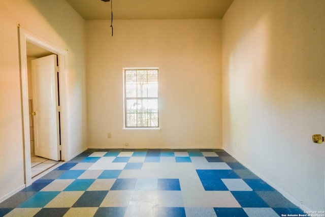 319 Vine St, San Antonio, TX 78210 - empty room featuring baseboards and tile patterned floors