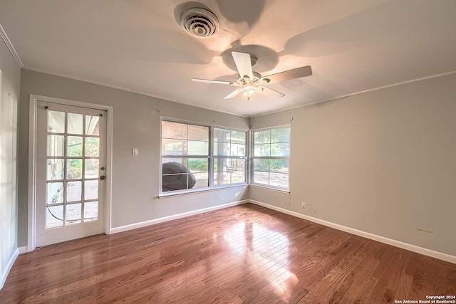 unfurnished room featuring hardwood / wood-style floors, ceiling fan, and ornamental molding