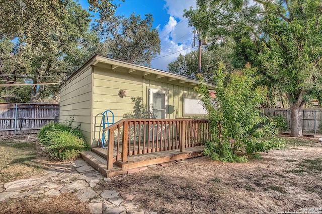 back of house featuring a deck