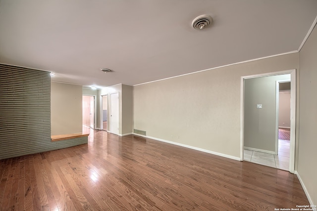 spare room with hardwood / wood-style flooring